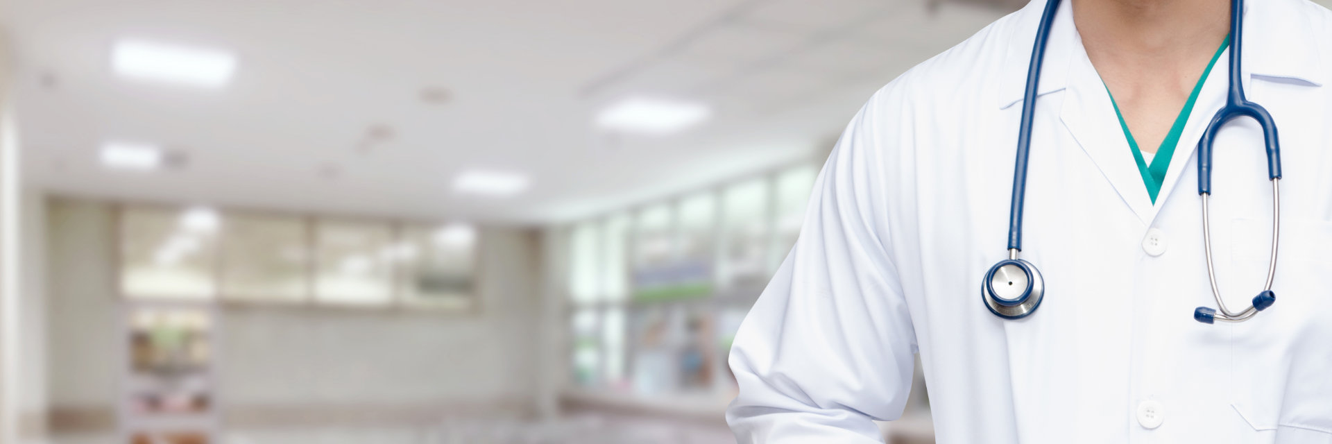 A doctor with a stethoscope worn over his neck.